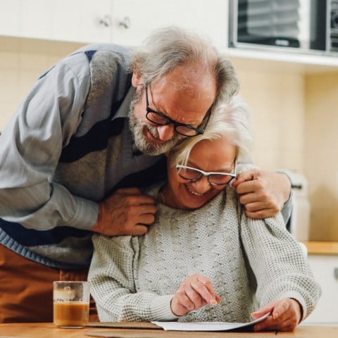 Sagora | Senior couple hugging and smiling
